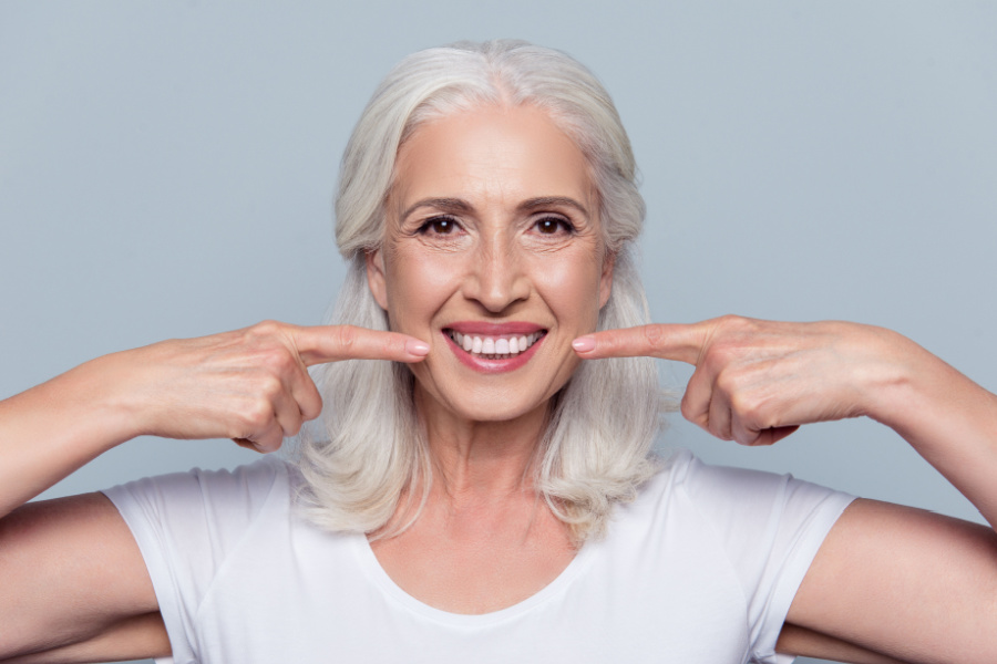 A full arch of teeth supported on just a few dental implants